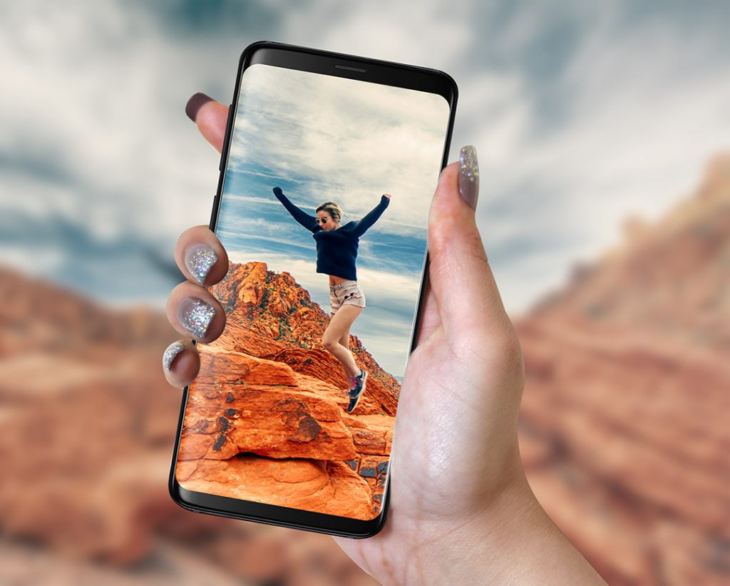 Samsung Galaxy S9 in Hand with picture of girl jumping