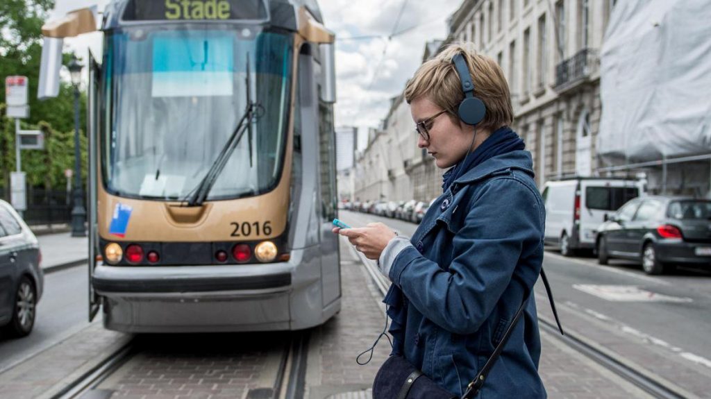smombies girl walks before a tram