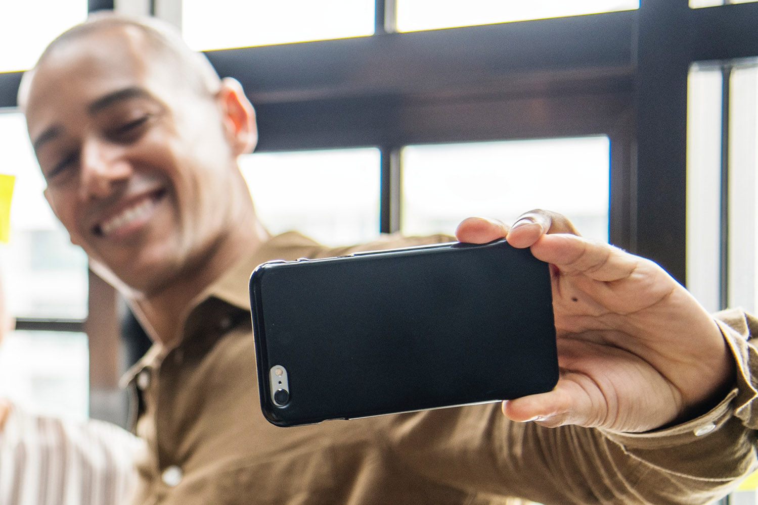 man-taking-a-selfie-smiling