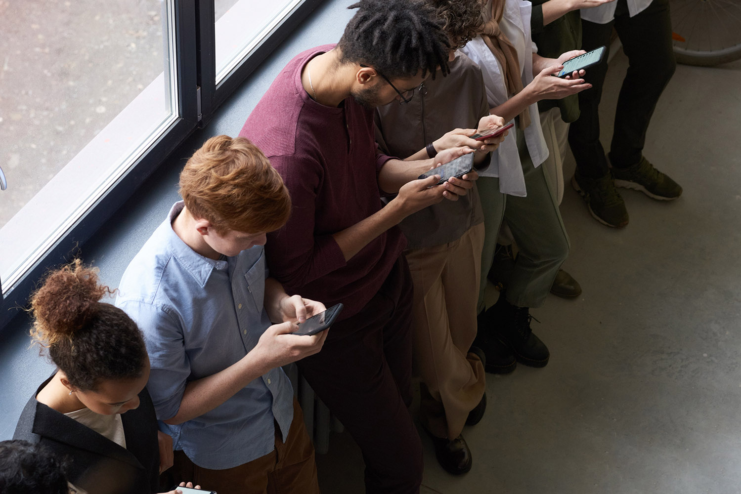 people-holding-their-phones-3184435