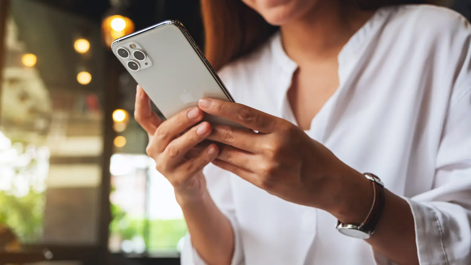 woman-holding-using-iphone