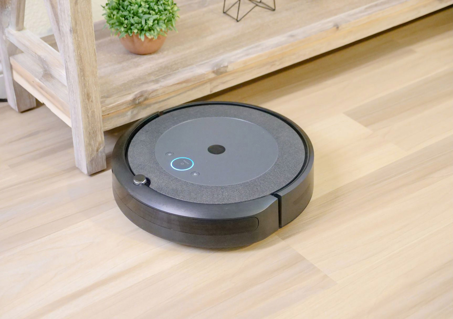 robot vacuum near table